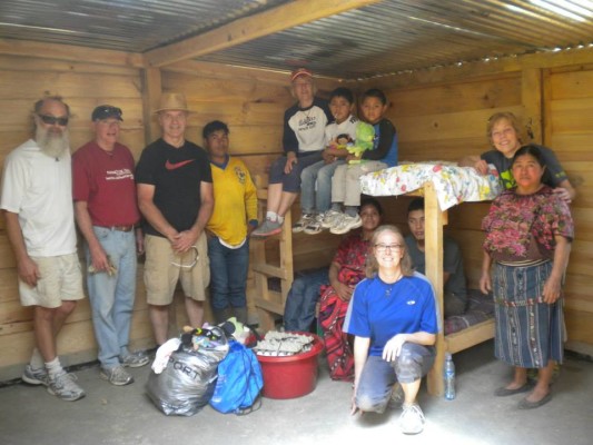 A Mayan widow and her daughters in a home built for her by the Shepherd of the Bay volunteers. 